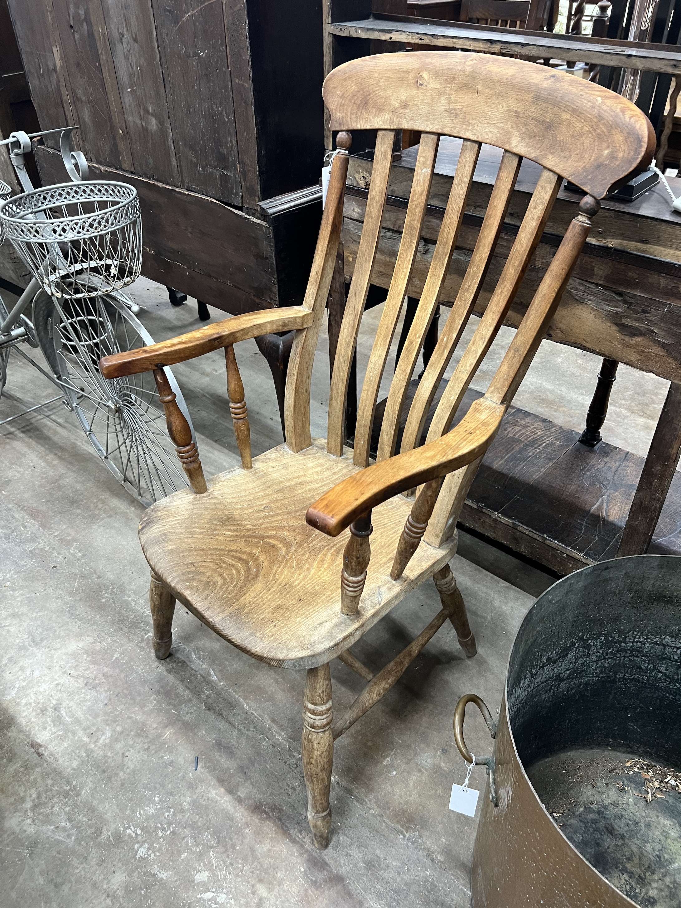 A Victorian elm and beech Windsor lathe back armchair, width 54cm, depth 47cm, height 110cm